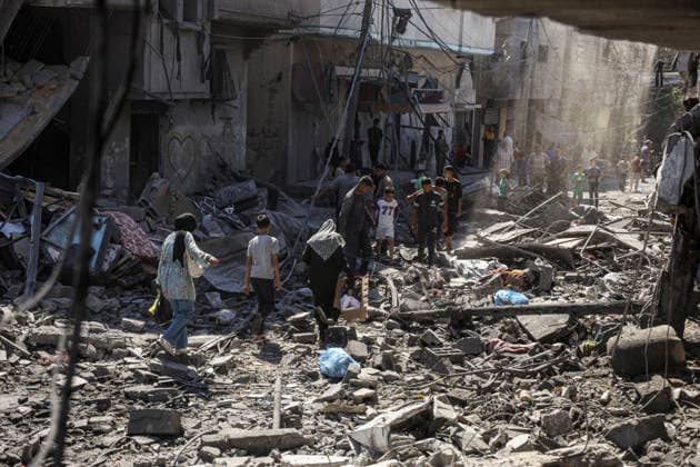 Nuseirat Homes Destroyed Airstrike Palestinian residents walk through debris following an Israeli strike in Nuseirat in the central Gaza Strip on May 26, 2026. The strike came amid the ongoing war between Israel and Hamas, which has devastated large parts of the Gaza Strip and displaced much of its population. Nuseirat Gaza Strip Palestinian Territories Copyright: xAhmedxYounisx