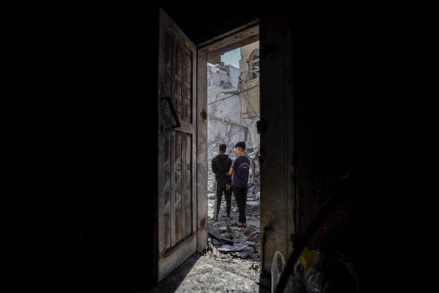 Nuseirat Homes Destroyed Airstrike Palestinian residents walk through debris following an Israeli strike in Nuseirat in the central Gaza Strip on May 26, 2026. The strike came amid the ongoing war between Israel and Hamas, which has devastated large parts of the Gaza Strip and displaced much of its population. Nuseirat Gaza Strip Palestinian Territories Copyright: xAhmedxYounisx