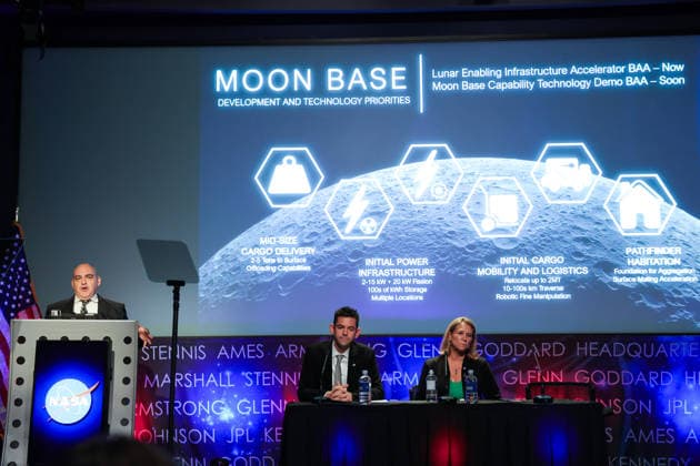 May 26, 2026, Washington, District Of Columbia, USA: Joined onstage by NASA Administrator JARED ISAACMAN and LORI GLAZE, Acting Associate Administrator, Exploration Systems Development Mission Directorate, NASA, CARLOS GARCIA-GALAN, Program Executive, Moon Base, NASA, left at podium, speaks at a press conference announcing Moon Base plans and mission progress at NASA Headquarters in Washington, D.C. on May 26, 2026. NASA s Moon Base program is a long-term lunar exploration and infrastructure initiative designed to enable sustained human presence at the lunar South Pole. Washington USA  - ZUMAd227 20260526_znp_d227_011 Copyright: xBryanxDozierx