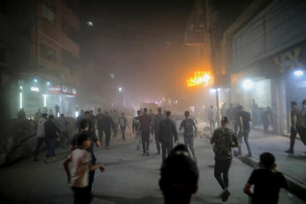 Gaza Rimal District Rocked Strikes Palestinians gather at the site of an airstrike in the Al-Rimal neighborhood of central Gaza City on May 26, 2026, after seven Israeli airstrikes hit a residential building and caused heavy damage to nearby vehicles and commercial shops. Several people were killed and others injured in the strikes, including passersby who had been shopping ahead of Eid. Gaza Gaza Strip Palestinian Territories Copyright: xSaeedxJarasx