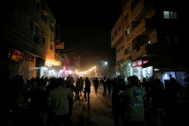 Gaza Rimal District Rocked Strikes Palestinians gather at the site of an airstrike in the Al-Rimal neighborhood of central Gaza City on May 26, 2026, after seven Israeli airstrikes hit a residential building and caused heavy damage to nearby vehicles and commercial shops. Several people were killed and others injured in the strikes, including passersby who had been shopping ahead of Eid. Gaza Gaza Strip Palestinian Territories Copyright: xSaeedxJarasx