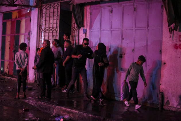 Gaza Rimal District Rocked Strikes Palestinians gather at the site of an airstrike in the Al-Rimal neighborhood of central Gaza City on May 26, 2026, after seven Israeli airstrikes hit a residential building and caused heavy damage to nearby vehicles and commercial shops. Several people were killed and others injured in the strikes, including passersby who had been shopping ahead of Eid. Gaza Gaza Strip Palestinian Territories Copyright: xSaeedxJarasx