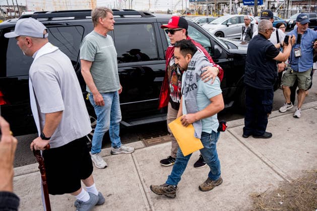A released detainee is escorted to the help tents after being released from Delaney Hall Detention Center in Newark, N.J. on Wednesday, May 27, 2026. Detainees have started a hunger strike to protest what they call inhumane conditions inside the ICE detention center.  NYP202605279010 ANGELINAxKATSANIS