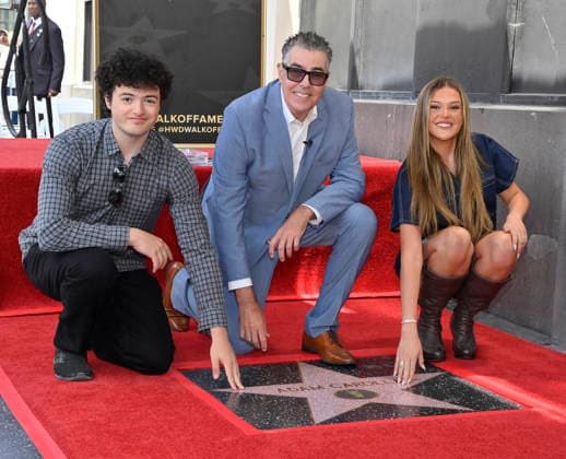 Comedy, actor, radio personality and television host Adam Corolla is joined by his son Santino Richard Carolla (L) and daughter Natalia Carolla during an unveiling ceremony honoring him with the 2,846th star on the Hollywood Walk of Fame in Los Angeles on Wednesday, May 27, 2026.  LAP2026052713 JIMxRUYMEN