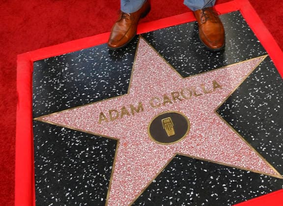 Comedy, actor, radio personality and television host Adam Corolla stands on his star during an unveiling ceremony honoring him with the 2,846th star on the Hollywood Walk of Fame in Los Angeles on Wednesday, May 27, 2026.  LAP2026052716 JIMxRUYMEN