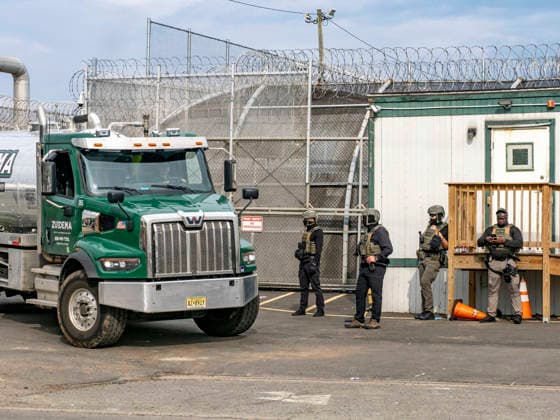 May 27, 2026, Newark, New Jersey, USA: ICE agents wearing bullet-proof vests allow a sewage truck to exit the Delaney Hall ICE detention center. Detainees inside continue their hunger and labor strike over inhumane conditions and due process violations. Supporters of the detainees are nearby. Newark USA - ZUMAd155 20260527_znp_d155_016 Copyright: xSuexDorfmanx