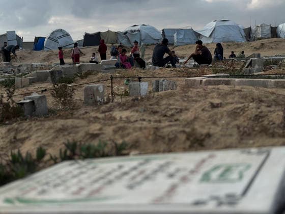 Eid Al Adha Cemetery Memorial Khan Yunis People gather among graves to offer prayers during Eid al-Adha at a cemetery in Khan Yunis, Gaza Strip, on May 27, 2026. Eid al-Adha, or the Feast of Sacrifice, is one of the most important holidays in the Islamic calendar, commemorating the willingness of Prophet Ibrahim to sacrifice his son. The event is traditionally marked worldwide by communal prayers, family gatherings, acts of charity, and the slaughtering of livestock. In Gaza, the ongoing conflict has significantly impacted traditional observances, leading to residents substituting fresh livestock with frozen meat and visiting the graves of those killed during the war. Khan Yunis Gaza Strip Palestinian Territories Copyright: xDoaaxAlbazx