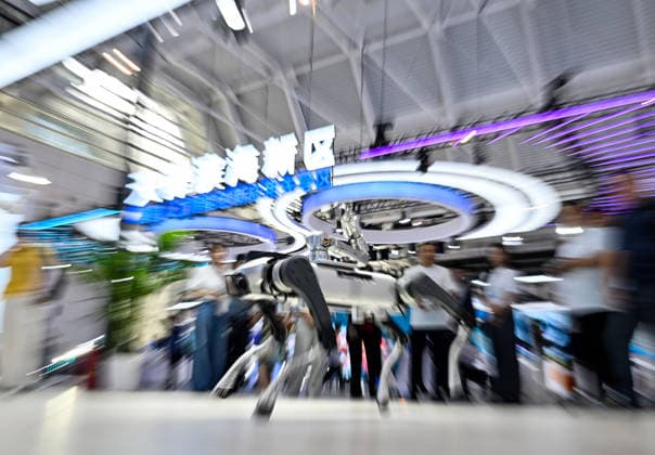 (260528) -- TIANJIN, May 28, 2026 -- People watch a robotic dog performing at the World Intelligence Expo 2026 in Tianjin, north China, May 28, 2026. Themed Intelligence: Extensive Development Space, Sustainable Growth Driver, the World Intelligence Expo 2026 kicked off here on Thursday. ) CHINA-TIANJIN-WORLD INTELLIGENCE EXPO (CN) ZhaoxZishuo 