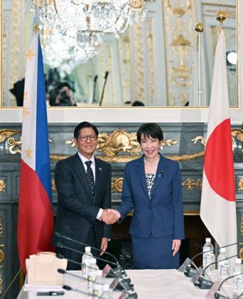 Japan-Philippines summit Japanese Prime Minister Sanae Takaichi (R) and Philippine President Ferdinand Marcos Jr. shake hands before their talks at the State Guest House in Tokyo on May 28, 2026. (Pool photo)  A14AA0005617049P