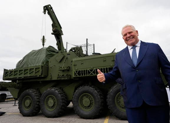 May 28, 2026, Ottawa, On, Canada: Premier of Ontario Doug Ford gives a thumbs up in front of a General Dynamics Land Systems-Canada (GDLS-C) Armoured Combat Support Vehicle (ACSV), as he arrives to speak at a news conference at the Canadian Association of Defence and Security Industries annual defence industry trade show CANSEC, in Ottawa, on Thursday, May 28, 2026. Ottawa Canada  - ZUMAc35_ 20260528_zaf_c35_008 Copyright: xJustinxTangx