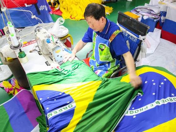 QINGDAO, CHINA - MAY 28: Workers are busy in front of an assembly line of flags for the FIFA World Cup at Qingdao Wonderful Flag Industry Co on May 28, 2026 in Qingdao, Shandong Province of China. As the 2026 FIFA World Cup is around the corner, production lines at a flag manufacturer in Qingdao, Shandong province, are running at full speed to produce various types of flags, many of which will soon appear in stadiums across North America.  Copyright: xVCGx 111644648670