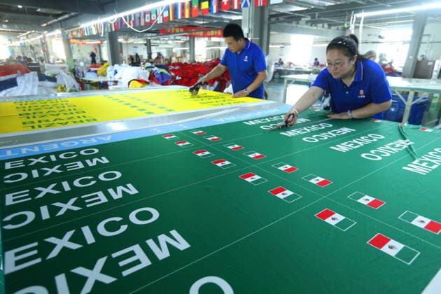QINGDAO, CHINA - MAY 28: Workers are busy in front of an assembly line of flags for the FIFA World Cup at Qingdao Wonderful Flag Industry Co on May 28, 2026 in Qingdao, Shandong Province of China. As the 2026 FIFA World Cup is around the corner, production lines at a flag manufacturer in Qingdao, Shandong province, are running at full speed to produce various types of flags, many of which will soon appear in stadiums across North America.  Copyright: xVCGx 111644611660