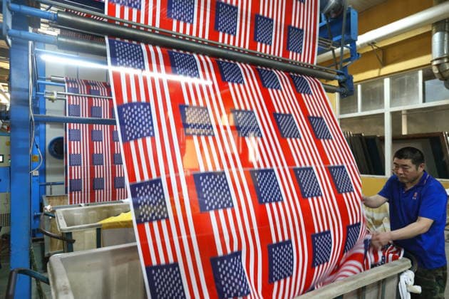 QINGDAO, CHINA - MAY 28: Workers are busy in front of an assembly line of flags for the FIFA World Cup at Qingdao Wonderful Flag Industry Co on May 28, 2026 in Qingdao, Shandong Province of China. As the 2026 FIFA World Cup is around the corner, production lines at a flag manufacturer in Qingdao, Shandong province, are running at full speed to produce various types of flags, many of which will soon appear in stadiums across North America.  Copyright: xVCGx 111644611655