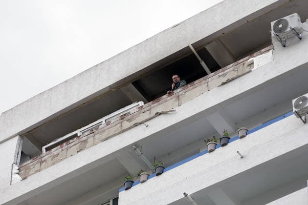 (260529) -- GALATI, May 29, 2026 -- A staff worker checks the residential apartment building damaged by a Russian drone in Galati, Romania, May 29, 2026. At least two people were injured after a drone struck a residential apartment building in Galati, Romania, near the border with Ukraine, local media reported Friday. (Photo by Xinhua) ROMANIA-GALATI-DRONE CristianxCristel 