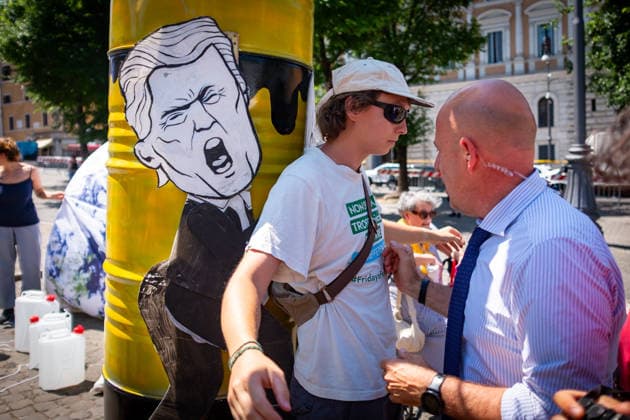 May 30, 2026, Rome, Rm, Italy: Extinction Rebellion activists are launching a 24-hour rally in Piazza dell Esquilino, just days before the 80th anniversary of the Italian Republic on June 2nd. They say: there is nothing to celebrate as long as rights, justice, and dignity continue to be denied. Oil extraction is imposed through violence and war to produce ever more energy, further increasing inequality. Plainclothes police remove drawings of Donald Trump and Giorgia Meloni pinned to a rocket made of oil drums. Rome Italy  - ZUMAg256 20260530_znp_g256_010 Copyright: xMarcoxDixGianvitox