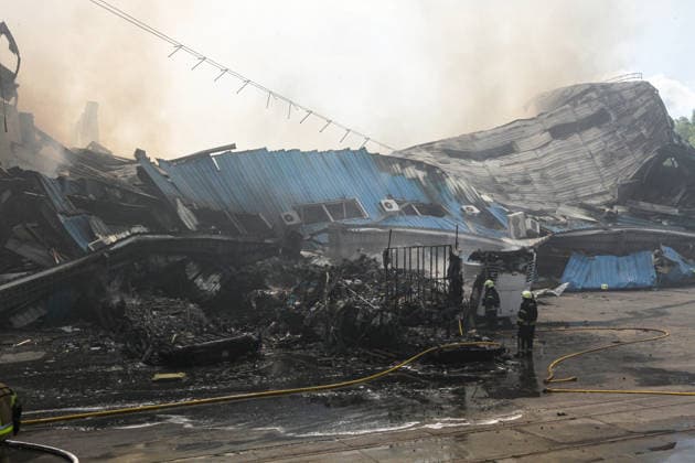 Rescuers deal with the aftermath of a Russian drone strike at Nova Poshta Branch No. 1 in Dnipro, Ukraine, on May 31, 2026. The strike destroyed the branch completely, with the building burning down. Cars parked nearby were also damaged. (Photo by Mykola Miakshykov Ukrinform) Russian drone attack destroys post branch in Dnipro  Copyright: xMykolaxMiakshykovx