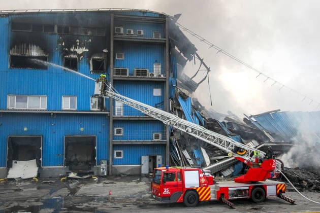 Rescuers use an aerial work platform to extinguish a fire at Nova Poshta Branch No. 1, destroyed by a Russian drone strike, Dnipro, Ukraine, on May 31, 2026. The strike destroyed the branch completely, with the building burning down. Cars parked nearby were also damaged. (Photo by Mykola Miakshykov Ukrinform) Russian drone attack destroys post branch in Dnipro  Copyright: xMykolaxMiakshykovx