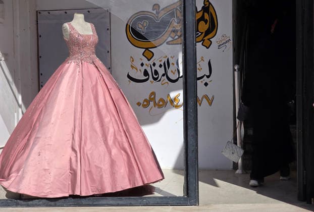 Customers browse wedding attire in Khan Younis despite wartime hardships Customers browse wedding dresses and suits inside a bridal shop in Khan Younis in the southern Gaza Strip on June 1, 2026, as Palestinians continue to uphold marriage traditions despite the ongoing war, widespread destruction, and difficult economic and humanitarian conditions. Shop owners say demand for wedding supplies remains present, though at a lower pace, as many families turn to less costly options amid declining incomes, rising prices, and shortages of goods linked to Israeli restrictions at border crossings. Photo by Tariq Mohammad APA Images Khan Yunis Gaza Strip Palestinian Territory 010626_Khan_Yunis_TM_00(28) Copyright: xapaimagesxTariqxMohammad xapaimagesx