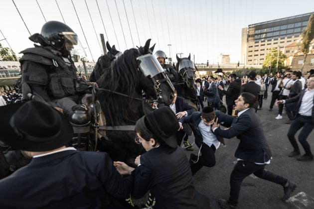 Ultra-Orthodox Jews protest mandatory military service in Jerusalem JERUSALEM - JUNE 1: Israeli police use stun grenades and mounted units to disperse ultra-Orthodox Jewish (Haredi) demonstrators protesting the detention of draft resisters and mandatory military service in West Jerusalem on June 1, 2026. Gathering at the Hamitarim Bridge, a major junction in the city, protesters condemned the arrest of nine Haredi men in Beit Shemesh a day earlier and blocked traffic, causing major disruptions before police moved to clear the roadway. Mostafa Alkharouf Anadolu Jerusalem Israel. Editorial use only. Please get in touch for any other usage.  Copyright: x2026xAnadoluxMostafaxAlkharoufx