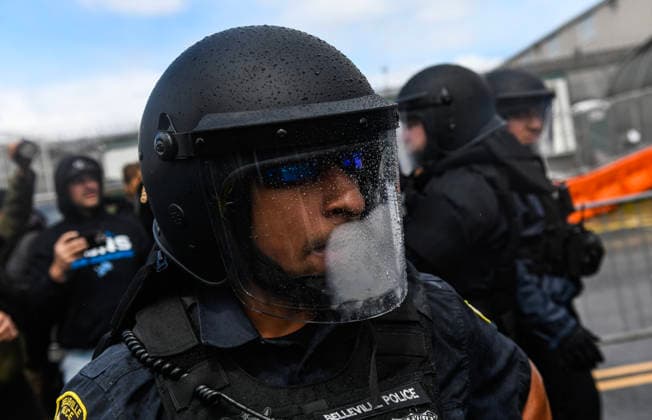 June 1, 2026, Newark, New Jersey, United States: Raindrops and fog obscure a police officers face visor while deploying to separate Pro-ICE supporters and protesters outside Delaney Hall during a protest. Protests continue to be held daily as detainees at Delaney Hall maintain a hunger and labor strike against current conditions at the facility. Newark United States  - ZUMAs197 20260601_aaa_s197_240 Copyright: xMatthewxHatcherx