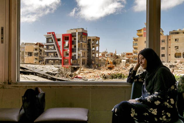 June 2, 2026, Tyre, Tyre, Lebanon: A Lebanese woman, sits at the window of partially destroyed Jabal Amel Hospital overlooking demolished buildings that were targeted by Israeli air strikes in the southern Lebanese port city of Tyre. Clashes have continued in southern Lebanon despite Israel and Hezbollah accepting a US plan for a partial ceasefire. President Donald Trump said on Monday that he had spoken to both sides and they agreed that all shooting will stop , after Iran warned Israeli military actions in Lebanon were a threat to the US-Iran ceasefire. Tyre Lebanon - ZUMAn313 20260602_zip_n313_002 Copyright: xMarwanxNaamanix