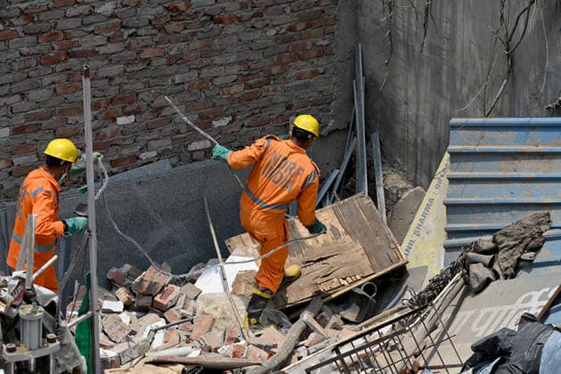 NEW DELHI, INDIA - JUNE 2: NDRF team conducts a search and rescue operation as a building collapsed after the cylinder blast in Mukundpur, Burari, on June 2, 2026 in New Delhi, India. Neighbours and officials alleged that a large number of cylinders were being stored illegally inside the house where the blast occurred. (Photo by Ishant Chauhan Hindustan Times ) House Collapses After Cylinder Blast In Delhi™s Mukundpur, People Feared Trapped Under Debris