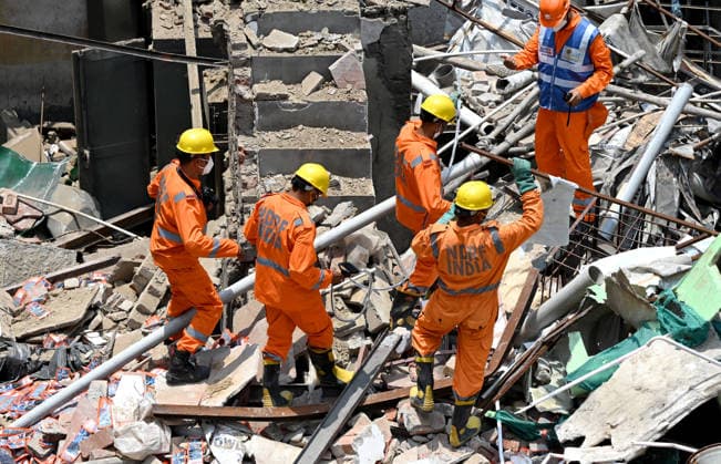 NEW DELHI, INDIA - JUNE 2: NDRF team conducts a search and rescue operation as a building collapsed after the cylinder blast in Mukundpur, Burari, on June 2, 2026 in New Delhi, India. Neighbours and officials alleged that a large number of cylinders were being stored illegally inside the house where the blast occurred. (Photo by Ishant Chauhan Hindustan Times ) House Collapses After Cylinder Blast In Delhi™s Mukundpur, People Feared Trapped Under Debris