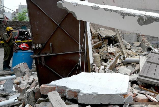 NEW DELHI, INDIA - JUNE 2: NDRF team conducts a search and rescue operation as a building collapsed after the cylinder blast in Mukundpur, Burari, on June 2, 2026 in New Delhi, India. Neighbours and officials alleged that a large number of cylinders were being stored illegally inside the house where the blast occurred. (Photo by Ishant Chauhan Hindustan Times ) House Collapses After Cylinder Blast In Delhi™s Mukundpur, People Feared Trapped Under Debris