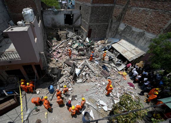 NEW DELHI, INDIA - JUNE 2: NDRF team conducts a search and rescue operation as a building collapsed after the cylinder blast in Mukundpur, Burari, on June 2, 2026 in New Delhi, India. Neighbours and officials alleged that a large number of cylinders were being stored illegally inside the house where the blast occurred. (Photo by Ishant Chauhan Hindustan Times ) House Collapses After Cylinder Blast In Delhi™s Mukundpur, People Feared Trapped Under Debris