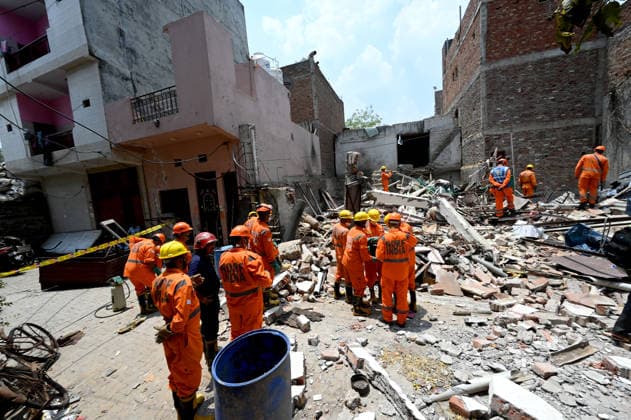 NEW DELHI, INDIA - JUNE 2: NDRF team conducts a search and rescue operation as a building collapsed after the cylinder blast in Mukundpur, Burari, on June 2, 2026 in New Delhi, India. Neighbours and officials alleged that a large number of cylinders were being stored illegally inside the house where the blast occurred. (Photo by Ishant Chauhan Hindustan Times ) House Collapses After Cylinder Blast In Delhi™s Mukundpur, People Feared Trapped Under Debris