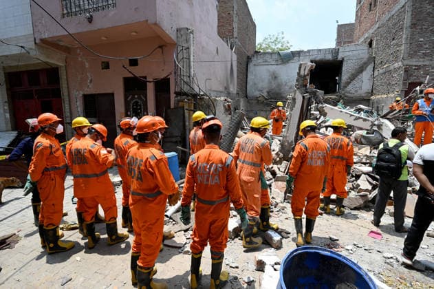 NEW DELHI, INDIA - JUNE 2: NDRF team conducts a search and rescue operation as a building collapsed after the cylinder blast in Mukundpur, Burari, on June 2, 2026 in New Delhi, India. Neighbours and officials alleged that a large number of cylinders were being stored illegally inside the house where the blast occurred. (Photo by Ishant Chauhan Hindustan Times ) House Collapses After Cylinder Blast In Delhi™s Mukundpur, People Feared Trapped Under Debris