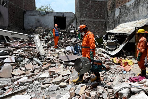 NEW DELHI, INDIA - JUNE 2: NDRF team conducts a search and rescue operation as a building collapsed after the cylinder blast in Mukundpur, Burari, on June 2, 2026 in New Delhi, India. Neighbours and officials alleged that a large number of cylinders were being stored illegally inside the house where the blast occurred. (Photo by Ishant Chauhan Hindustan Times ) House Collapses After Cylinder Blast In Delhi™s Mukundpur, People Feared Trapped Under Debris