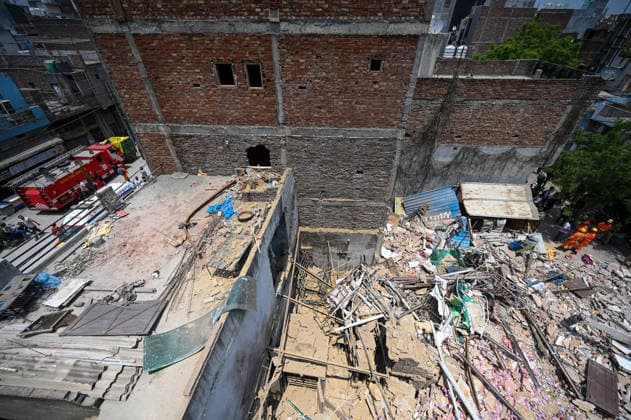 NEW DELHI, INDIA - JUNE 2: NDRF team conducts a search and rescue operation as a building collapsed after the cylinder blast in Mukundpur, Burari, on June 2, 2026 in New Delhi, India. Neighbours and officials alleged that a large number of cylinders were being stored illegally inside the house where the blast occurred. (Photo by Ishant Chauhan Hindustan Times ) House Collapses After Cylinder Blast In Delhi™s Mukundpur, People Feared Trapped Under Debris