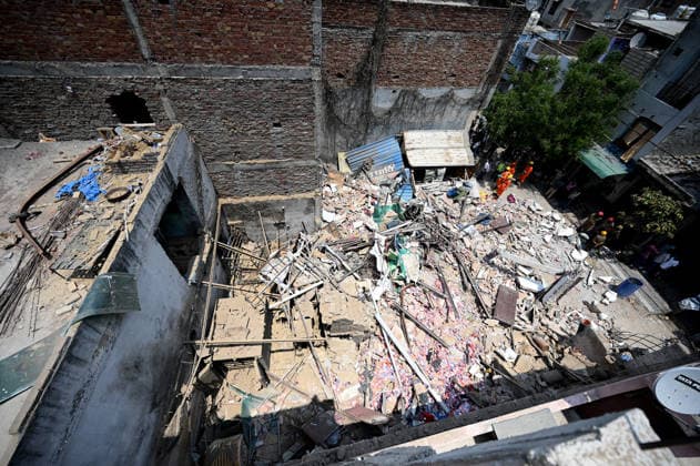 NEW DELHI, INDIA - JUNE 2: NDRF team conducts a search and rescue operation as a building collapsed after the cylinder blast in Mukundpur, Burari, on June 2, 2026 in New Delhi, India. Neighbours and officials alleged that a large number of cylinders were being stored illegally inside the house where the blast occurred. (Photo by Ishant Chauhan Hindustan Times ) House Collapses After Cylinder Blast In Delhi™s Mukundpur, People Feared Trapped Under Debris
