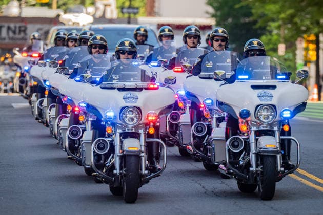 June 2, 2026, Arlington, Virginia, United States: The funeral procession for ARLINGTON COUNTY POLICE CORPORAL BARRY FOUST passes Arlington County Police Headquarters one final time following funeral services. Foust died after battling a 9 11-related illness linked to his service as a Pentagon first responder on September 11, 2001. Arlington United States  - ZUMAk206 20260602_znp_k206_011 Copyright: xMattxKaminskyx