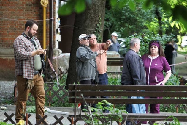Onlookers talk near a nine-storey apartment block hit by a Russian drone in Dnipro, Ukraine, on 2 June 2026. During the day, Russian occupation forces carried out another strike on the city, targeting a block of flats with a jet drone. As a result of the direct hit, one apartment burned to the ground, and neighbouring flats also sustained significant damage. Two children were injured and taken to the hospital with moderate injuries. (Photo by Mykola Miakshykov Ukrinform) Russian drone strikes block of flats in Dnipro  Copyright: xMykolaxMiakshykovx