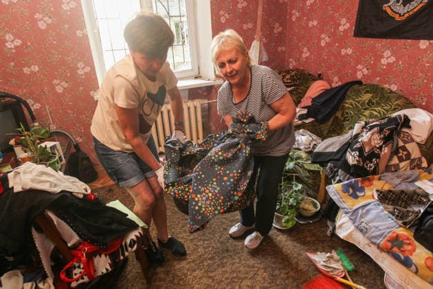 Two women in gloves remove glass shards from the living room in a nine-storey apartment block hit by a Russian drone in Dnipro, Ukraine, on 2 June 2026. During the day, Russian occupation forces carried out another strike on the city, targeting a block of flats with a jet drone. As a result of the direct hit, one apartment burned to the ground, and neighbouring flats also sustained significant damage. Two children were injured and taken to the hospital with moderate injuries. (Photo by Mykola Miakshykov Ukrinform) Russian drone strikes block of flats in Dnipro  Copyright: xMykolaxMiakshykovx