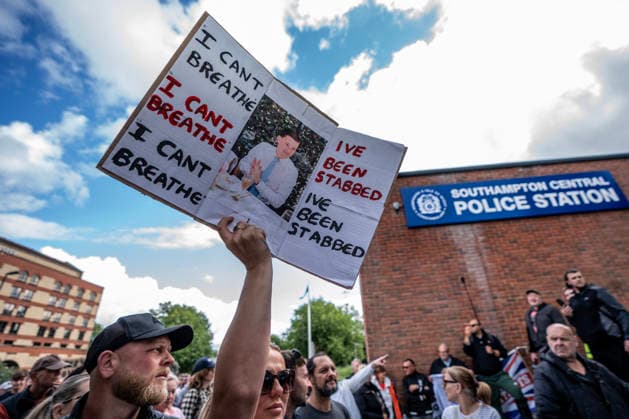 June 2, 2026, London, United Kingdom: Protestor outside Southampton Central Police Station holds a placard during the rally. Southampton locals organized a flash protest following the release of Police body-cam footage of the arrest and subsequent death of Henry Nowak. The 18 year old was handcuffed by Hampshire Constabulary who accused him of racial abuse and did not believe that he had been stabbed. He subsequently bled to death in custody. The protest outside Southampton Central Police Station accused the government of 2 tier policing. London United Kingdom - ZUMAs197 20260602_aaa_s197_095 Copyright: xLabxMox