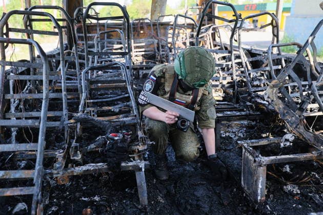 RUSSIA, DONETSK PEOPLE S REPUBLIC - JUNE 3, 2026: A Russian Investigative Committee officer in a Moscow-to-Simferopol intercity coach after It was hit by a Ukrainian combat drone in Yenakiyevo. According to early reports, seven civilians were killed and 11 more people sustained various injuries. Dmitry Yagodkin TASS  93321400