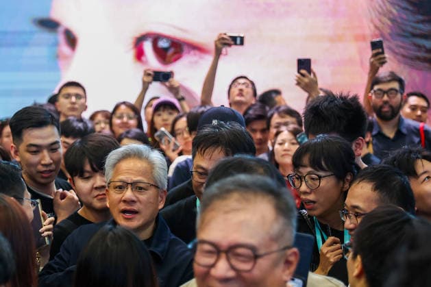 NVIDIA s CEO Jensen Huang visits COMPUTEX TAIPEI 2026 TAIPEI, TAIWAN - JUNE 3: Jensen Huang, the CEO of American multinational tech giant NVIDIA, is surrounded by heaps of supporters and staff during his visit to the COMPUTEX TAIPEI trade show, in Taipei, Taiwan, on June 3, 2026. COMPUTEX TAIPEI is one of the world’s largest and most significant trade shows, featuring latest technologies, drones, data centres, Artificial Intelligence (AI) technologies, supercomputers, semiconductors products and other things from major international firms such as Nvidia, Intel, NXP and Foxconn. Daniel Ceng Anadolu Taipei Taiwan. Editorial use only. Please get in touch for any other usage.  Copyright: x2026xAnadoluxDanielxCengx