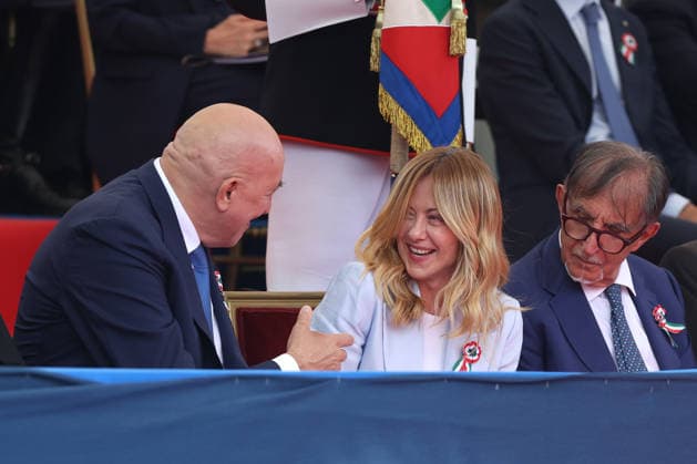 June 2, 2026, Rome, Italy: (L to R) Minister of Defense Guido Crosetto jokes with Prime Minister Giorgia Meloni at his side President of the Senate Ignazio La Russa during the parade. Heads of state and government attended the 80th Anniversary of Republic Day celebrations and the traditional military parade through the Imperial Fora. The ceremony, which pays homage to the values ??of the Republic and the Armed Forces, took place in the heart of the capital before the highest Italian institutional officials and international delegations. Rome Italy  - ZUMAs197 20260602_aaa_s197_236 Copyright: xMarcoxIacobuccix