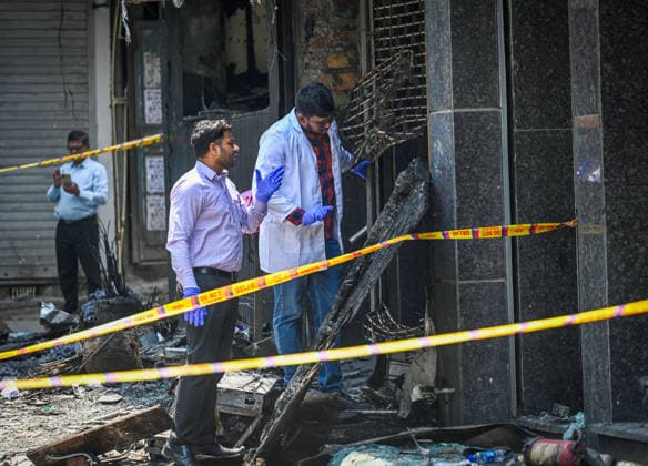 NEW DELHI, INDIA - JUNE 3: Firefighters and rescue personnel conduct rescue and recovery operations after a massive fire broke out in a five-storey building housing a restaurant and bed-and-breakfast guest accommodation in the highly congested Hauz Rani area of Malviya Nagar on June 3, 2026 in New Delhi, India. The blaze at the Flourish Stay B&B and Lemon Green Restaurant started around 8.30 am and quickly spread, catching everybody unawares. Rescue workers, including many locals, rushed to the spot to pull out those trapped inside the five-floor narrow building. About 40 people were rescued and rushed to hospital where 21 were declared brought dead, officials said. The death toll could rise with several of the injured in a critical conditi