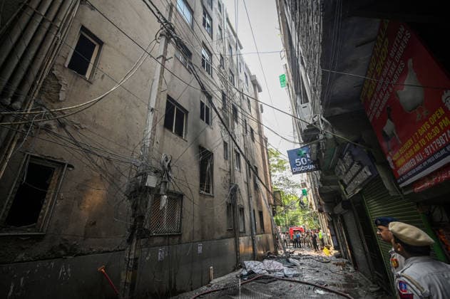 NEW DELHI, INDIA - JUNE 3: Firefighters and rescue personnel conduct rescue and recovery operations after a massive fire broke out in a five-storey building housing a restaurant and bed-and-breakfast guest accommodation in the highly congested Hauz Rani area of Malviya Nagar on June 3, 2026 in New Delhi, India. The blaze at the Flourish Stay B&B and Lemon Green Restaurant started around 8.30 am and quickly spread, catching everybody unawares. Rescue workers, including many locals, rushed to the spot to pull out those trapped inside the five-floor narrow building. About 40 people were rescued and rushed to hospital where 21 were declared brought dead, officials said. The death toll could rise with several of the injured in a critical conditi