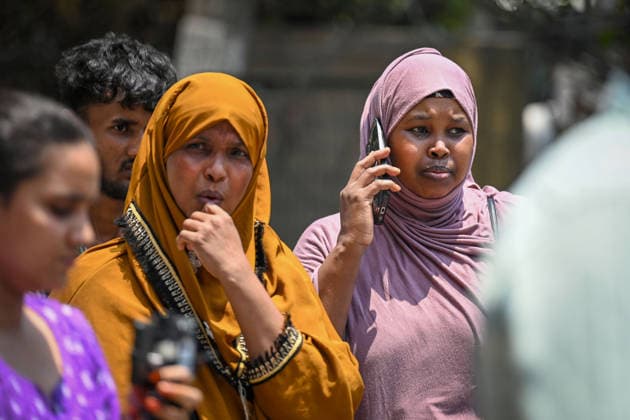NEW DELHI, INDIA - JUNE 3: Family members of the victims seen present on the site as firefighters and rescue personnel conduct rescue and recovery operations after a massive fire broke out in a five-storey building housing a restaurant and bed-and-breakfast guest accommodation in the highly congested Hauz Rani area of Malviya Nagar on June 3, 2026 in New Delhi, India. The blaze at the Flourish Stay B&B and Lemon Green Restaurant started around 8.30 am and quickly spread, catching everybody unawares. Rescue workers, including many locals, rushed to the spot to pull out those trapped inside the five-floor narrow building. About 40 people were rescued and rushed to hospital where 21 were declared brought dead, officials said. The death toll co