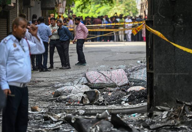 NEW DELHI, INDIA - JUNE 3: Firefighters and rescue personnel conduct rescue and recovery operations after a massive fire broke out in a five-storey building housing a restaurant and bed-and-breakfast guest accommodation in the highly congested Hauz Rani area of Malviya Nagar on June 3, 2026 in New Delhi, India. The blaze at the Flourish Stay B&B and Lemon Green Restaurant started around 8.30 am and quickly spread, catching everybody unawares. Rescue workers, including many locals, rushed to the spot to pull out those trapped inside the five-floor narrow building. About 40 people were rescued and rushed to hospital where 21 were declared brought dead, officials said. The death toll could rise with several of the injured in a critical conditi