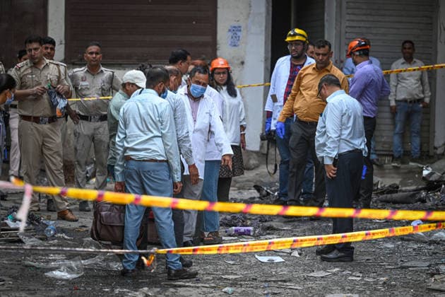 NEW DELHI, INDIA - JUNE 3: Firefighters and rescue personnel conduct rescue and recovery operations after a massive fire broke out in a five-storey building housing a restaurant and bed-and-breakfast guest accommodation in the highly congested Hauz Rani area of Malviya Nagar on June 3, 2026 in New Delhi, India. The blaze at the Flourish Stay B&B and Lemon Green Restaurant started around 8.30 am and quickly spread, catching everybody unawares. Rescue workers, including many locals, rushed to the spot to pull out those trapped inside the five-floor narrow building. About 40 people were rescued and rushed to hospital where 21 were declared brought dead, officials said. The death toll could rise with several of the injured in a critical conditi