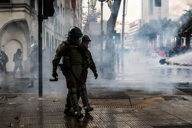 Thousands of students take to Chilean streets over planned education cuts SANTIAGO, CHILE - JUNE 3: Police officers walk through tear gas during an anti-government protest in Santiago, Chile, on June 3, 2026. Thousands of protesters took to the streets of Santiago to demonstrate against the austerity measures announced by President Jose Antonio Kast during his latest State of the Nation address. Cristobal Basaure Anadolu Santiago Chile. Editorial use only. Please get in touch for any other usage.  Copyright: x2026xAnadoluxCristobalxBasaurex