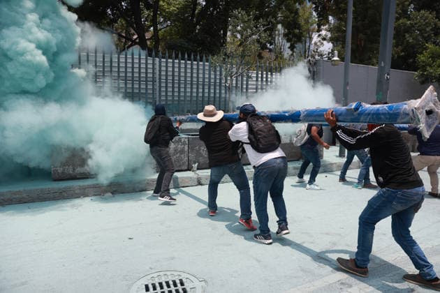 CNTE teachers hold third day of protests in Mexico City after declaring indefinite national strike MEXICO CITY, MEXICO - JUNE 03: Demonstrators attempt to breach the gates of the Mexico s Education Ministry building as riot police discharge fire extinguishers at them during a protest by CNTE teachers, in Mexico City, Mexico on June 03, 2026. Members of National Coordination of Education Workers (CNTE) forced their way into Mexico s Education Ministry building, causing damage to the facilities, as part of the third day of protests following the declaration of a national strike. Daniel Cardenas Anadolu Mexico City Mexico. Editorial use only. Please get in touch for any other usage.  Copyright: x2026xAnadoluxDanielxCardenasx