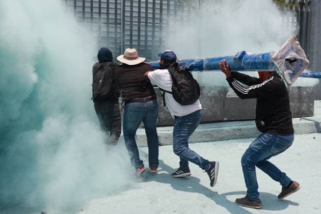 CNTE teachers hold third day of protests in Mexico City after declaring indefinite national strike MEXICO CITY, MEXICO - JUNE 03: Demonstrators attempt to breach the gates of the Mexico s Education Ministry building as riot police discharge fire extinguishers at them during a protest by CNTE teachers, in Mexico City, Mexico on June 03, 2026. Members of National Coordination of Education Workers (CNTE) forced their way into Mexico s Education Ministry building, causing damage to the facilities, as part of the third day of protests following the declaration of a national strike. Daniel Cardenas Anadolu Mexico City Mexico. Editorial use only. Please get in touch for any other usage.  Copyright: x2026xAnadoluxDanielxCardenasx