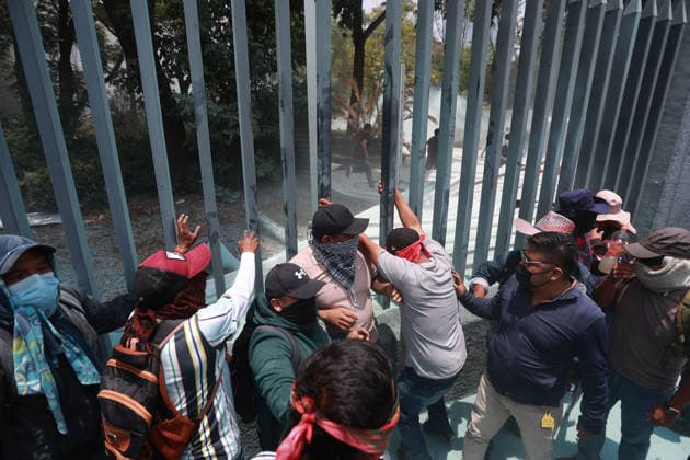 CNTE teachers hold third day of protests in Mexico City after declaring indefinite national strike MEXICO CITY, MEXICO - JUNE 03: Demonstrators climb over the gates to enter Mexico s Education Ministry building during a protest by CNTE teachers, in Mexico City, Mexico on June 03, 2026. Members of National Coordination of Education Workers (CNTE) forced their way into Mexico s Education Ministry building, causing damage to the facilities, as part of the third day of protests following the declaration of a national strike. Daniel Cardenas Anadolu Mexico City Mexico. Editorial use only. Please get in touch for any other usage.  Copyright: x2026xAnadoluxDanielxCardenasx